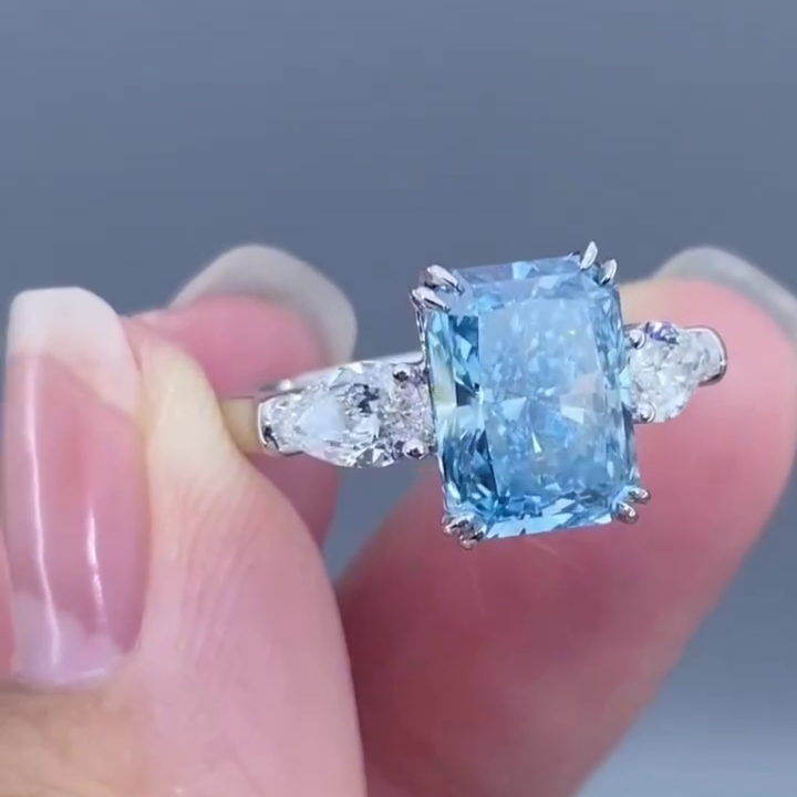 Radiant 4.50tcw Fancy Blue Lab Diamond Ring with Pear Sides | 3 Stone | IGI Certified
