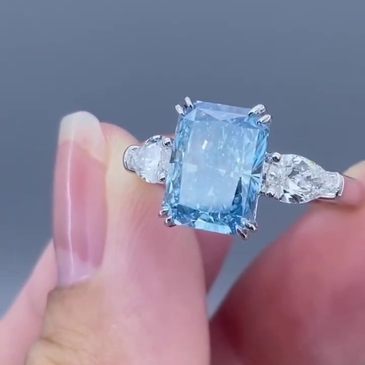 Radiant 4.50tcw Fancy Blue Lab Diamond Ring with Pear Sides | 3 Stone | IGI Certified