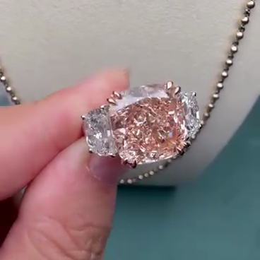 Fancy Pink 7.00tcw Lab Diamond 3-Stone Engagement Ring | 5ct Cushion Center + 2ct Side Stones | IGI Certified