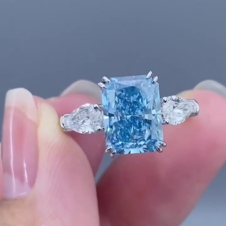 Radiant 4.50tcw Fancy Blue Lab Diamond Ring with Pear Sides | 3 Stone | IGI Certified
