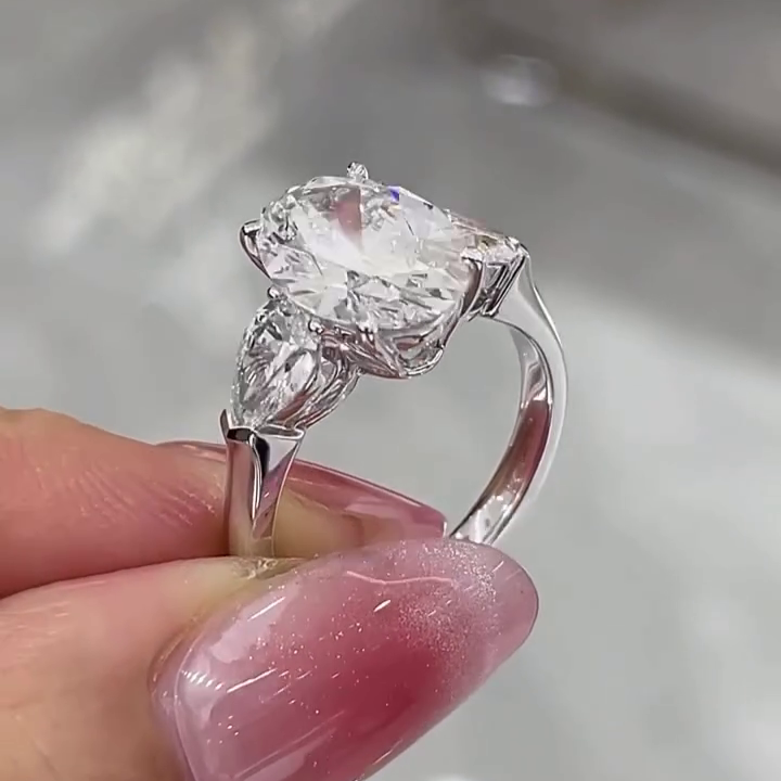 Oval 5.00tcw Lab Grown Diamond 3 Stone Engagement Ring | D-E-F Color VVS-VS Clarity | Pear Side Stones | IGI Certified