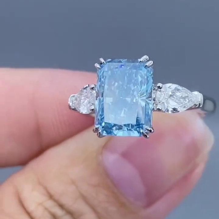 Radiant 4.50tcw Fancy Blue Lab Diamond Ring with Pear Sides | 3 Stone | IGI Certified