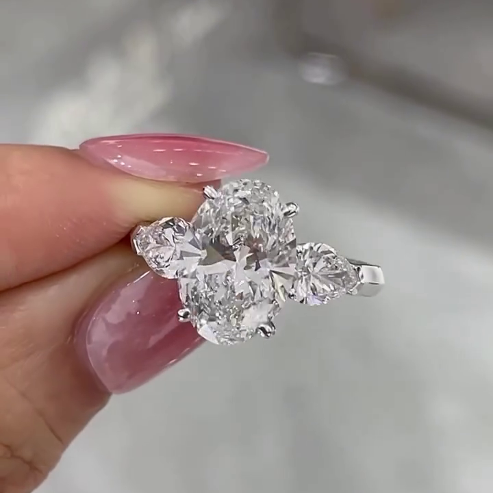 Oval 5.00tcw Lab Grown Diamond 3 Stone Engagement Ring | D-E-F Color VVS-VS Clarity | Pear Side Stones | IGI Certified