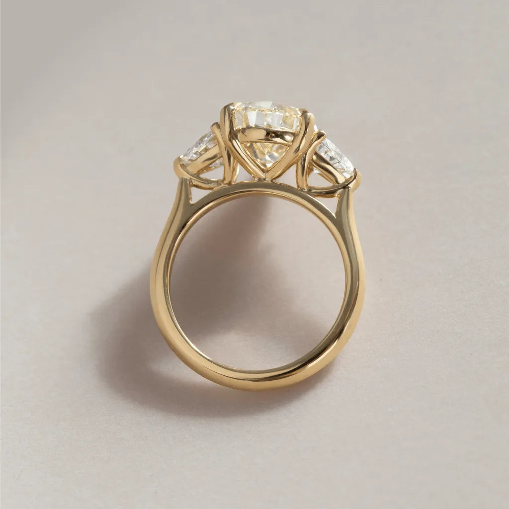 Common :: fancy yellow pear cut lab diamond trilogy engagement ring IGI certified