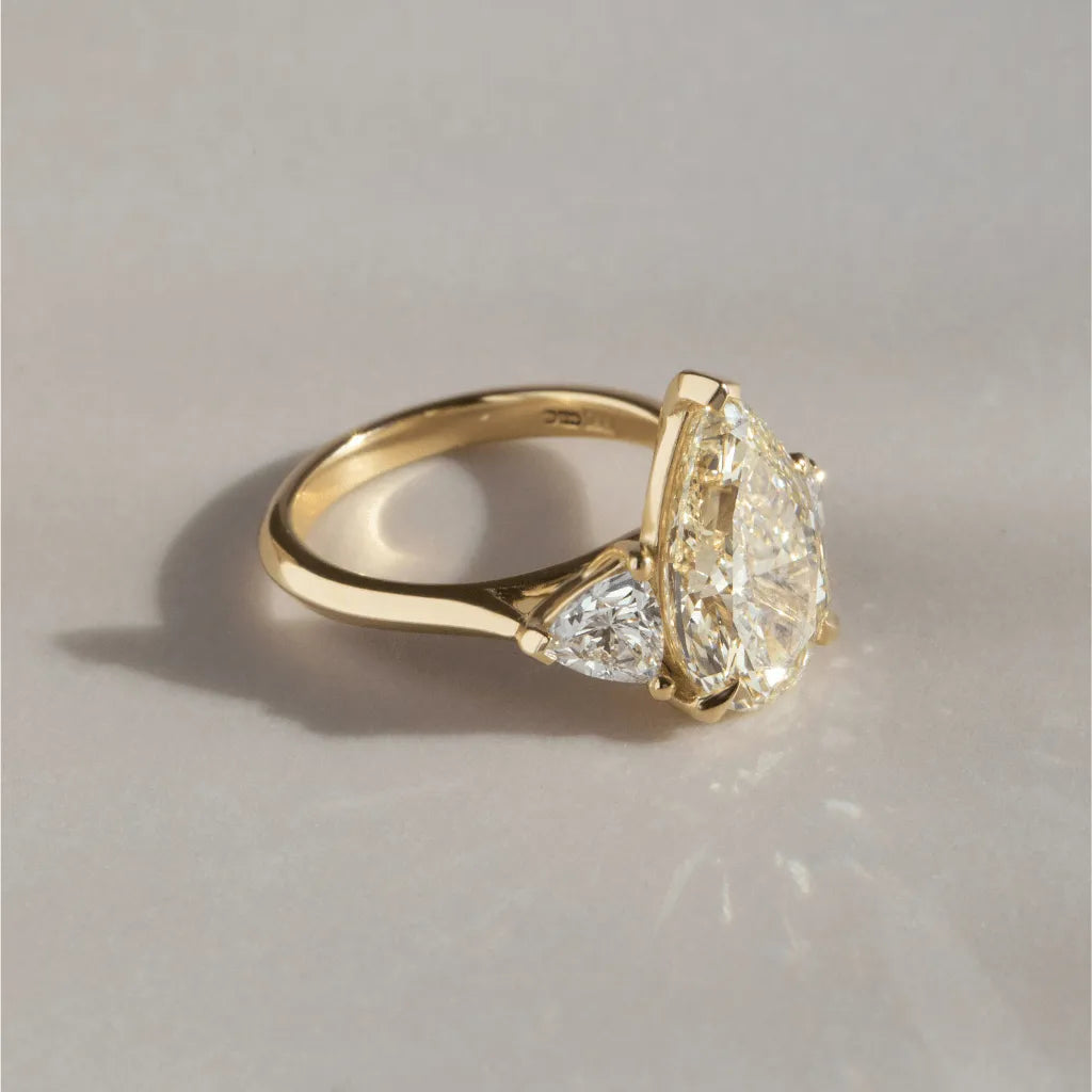 Common :: designer yellow pear lab diamond ring three stone engagement jewelry