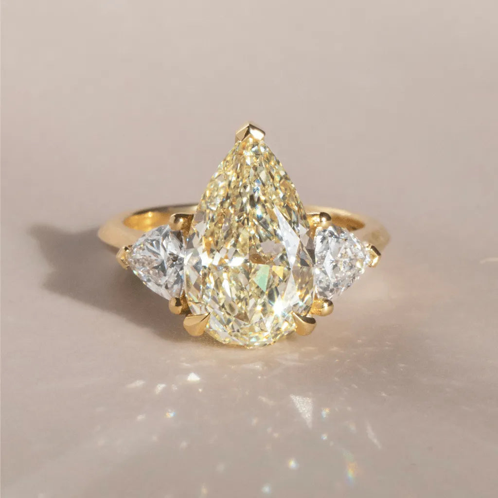 Common :: Zenvorae 5.17 carat yellow pear three stone lab grown diamond engagement ring IGI certified