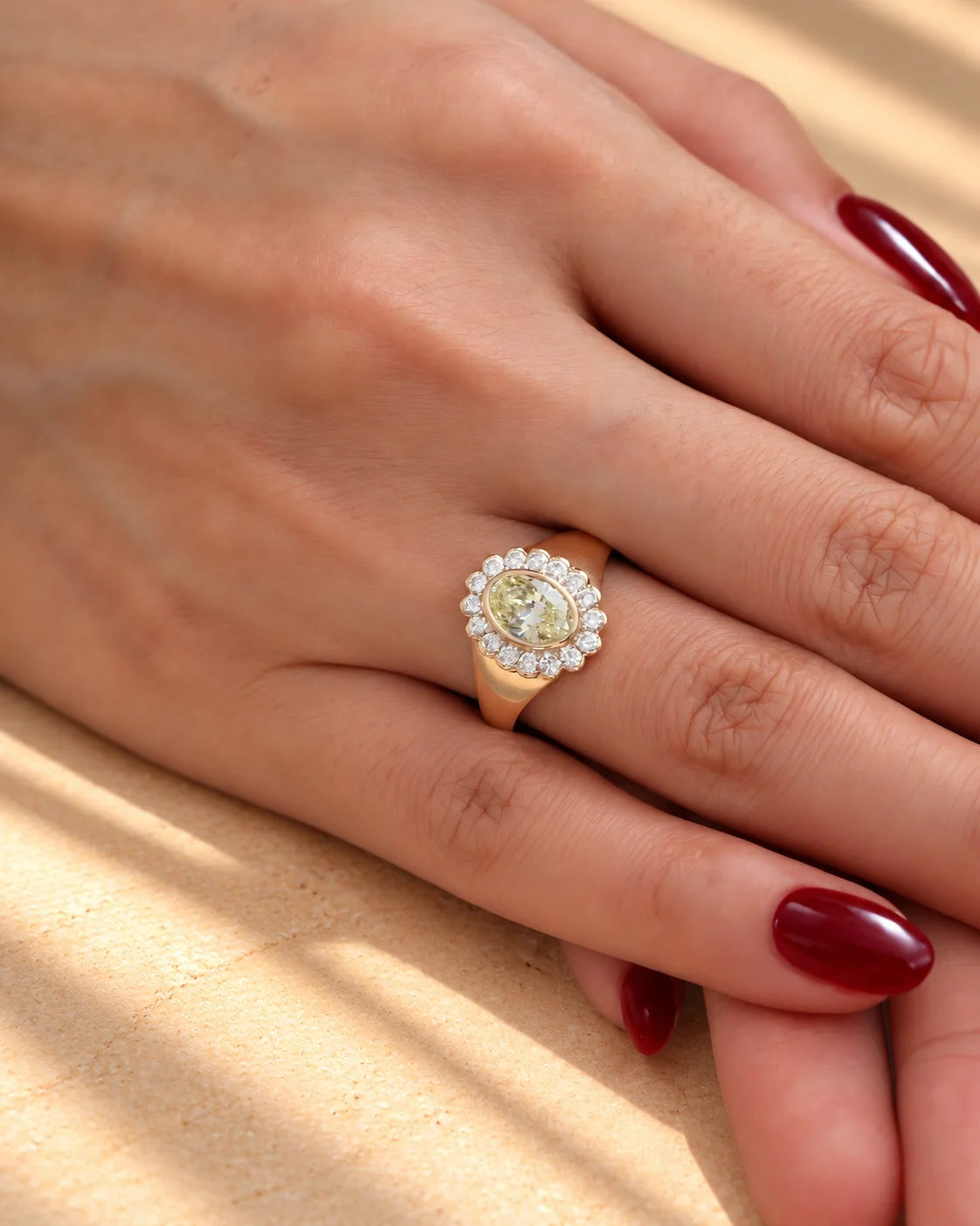 Common :: Close-up of a yellow oval diamond engagement ring with round accent diamonds